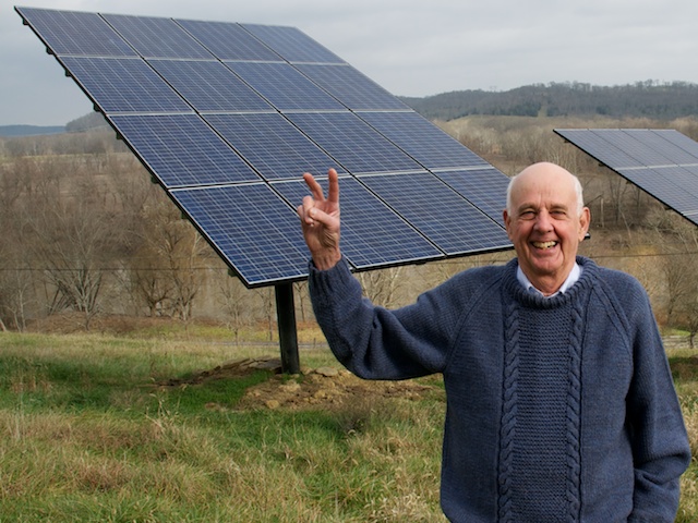 Wendell Berry stands before the solar panels on his farm in Henry County, KY. Photo by Guy Mendes